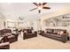 Open living space with leather sofas, a view to the kitchen and dining area at 2301 E Azalea Dr, Chandler, AZ 85286