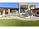 Luxury backyard oasis featuring a large pool, spa, and expansive patio at 8170 E Golden Spur Ln, Carefree, AZ 85377