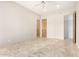 Spacious bedroom with tile floors and wood doors at 8170 E Golden Spur Ln, Carefree, AZ 85377