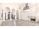 Open living space with high ceilings, columns and fireplace at 8170 E Golden Spur Ln, Carefree, AZ 85377