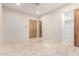 Light and airy bedroom with wood doors and walk-in closet at 8170 E Golden Spur Ln, Carefree, AZ 85377