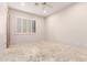 Bright bedroom featuring tile floors and window shutters at 8170 E Golden Spur Ln, Carefree, AZ 85377
