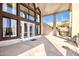 Covered patio with large windows and doors leading to the backyard at 8170 E Golden Spur Ln, Carefree, AZ 85377