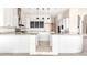 Modern kitchen featuring granite countertops and white cabinets at 8170 E Golden Spur Ln, Carefree, AZ 85377