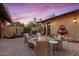 Inviting patio with fire pit and seating area, perfect for outdoor entertaining at 36975 N Mirabel Club Dr, Scottsdale, AZ 85262