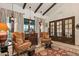 Cozy sitting area with comfortable armchairs and a view to the back at 36975 N Mirabel Club Dr, Scottsdale, AZ 85262