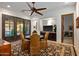 Charming dining area with a round table, four chairs, and access to a backyard patio at 36975 N Mirabel Club Dr, Scottsdale, AZ 85262