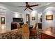 Cozy breakfast nook with a round table and four chairs, built in cabinetry, and a flat screen TV at 36975 N Mirabel Club Dr, Scottsdale, AZ 85262