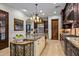 Spacious kitchen with large island, granite countertops, and stainless steel appliances at 36975 N Mirabel Club Dr, Scottsdale, AZ 85262