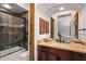 Clean bathroom with a shower/tub combo and dark wood vanity at 36975 N Mirabel Club Dr, Scottsdale, AZ 85262