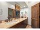 Bright bathroom with double vanity, and neutral color scheme at 36975 N Mirabel Club Dr, Scottsdale, AZ 85262