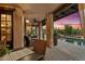 Relaxing patio with wicker furniture and sunset views at 36975 N Mirabel Club Dr, Scottsdale, AZ 85262