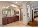 Elegant bathroom with double vanity, granite countertops, and large mirror at 36975 N Mirabel Club Dr, Scottsdale, AZ 85262