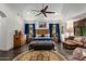 Main bedroom with sitting area and dark wood furnishings at 36975 N Mirabel Club Dr, Scottsdale, AZ 85262
