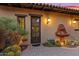 Inviting exterior with a charming fountain and well-landscaped courtyard at 36975 N Mirabel Club Dr, Scottsdale, AZ 85262