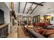 Living area with a large stone fireplace and high ceilings at 36975 N Mirabel Club Dr, Scottsdale, AZ 85262