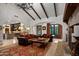 Spacious living room with a stone fireplace and comfortable seating at 36975 N Mirabel Club Dr, Scottsdale, AZ 85262