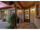 Elegant front entry with a charming wreath and Spanish-style architecture at 36975 N Mirabel Club Dr, Scottsdale, AZ 85262