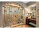 Spa-like bathroom featuring a walk-in shower with glass enclosure and marble tile at 36975 N Mirabel Club Dr, Scottsdale, AZ 85262