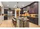 Gourmet kitchen with granite countertops and dark wood cabinets at 36975 N Mirabel Club Dr, Scottsdale, AZ 85262