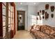 Sitting area with comfortable couch and eclectic wall decor at 36975 N Mirabel Club Dr, Scottsdale, AZ 85262