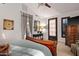 Elegant bedroom with wooden furniture and large windows at 36975 N Mirabel Club Dr, Scottsdale, AZ 85262