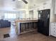 Open kitchen boasts a rustic island and flows into the living area at 7300 N 51St Ave # F93, Glendale, AZ 85301