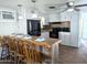 Kitchen with a wooden breakfast bar, white cabinets and black appliances at 7300 N 51St Ave # F93, Glendale, AZ 85301