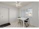 Small dining area with folding table and chairs at 10101 W Desert Rock Dr, Sun City, AZ 85351