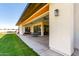 Covered patio with seating area and grassy backyard at 23008 E Galveston St, Mesa, AZ 85212