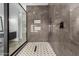 Large walk-in shower with gray marble tile and geometric accents at 23008 E Galveston St, Mesa, AZ 85212