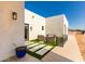 Backyard patio with artificial turf and seating area at 23008 E Galveston St, Mesa, AZ 85212