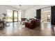 Spacious living room with leather sofa and large windows at 23008 E Galveston St, Mesa, AZ 85212