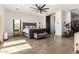Spacious main bedroom with plush bed, large closet, and exercise equipment at 23008 E Galveston St, Mesa, AZ 85212