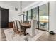 Dining room with a large wooden table and modern chandelier at 23008 E Galveston St, Mesa, AZ 85212