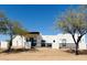 Front view of modern home with desert landscaping and fence at 23008 E Galveston St, Mesa, AZ 85212