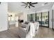 Gathering room featuring a comfy grey sofa and access to the backyard at 23008 E Galveston St, Mesa, AZ 85212