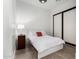 Bright bedroom with a queen bed, nightstand and closet at 23008 E Galveston St, Mesa, AZ 85212