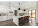 Modern kitchen with white cabinets and large island at 23008 E Galveston St, Mesa, AZ 85212