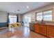 Bright kitchen with dining area, sliding door to backyard, and granite counters at 4251 E Sundance Ave, Gilbert, AZ 85297