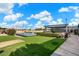 Tennis courts with covered seating area and surrounding landscape at 578 E Laddoos Ave, San Tan Valley, AZ 85140