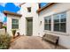 Front entry with green door and wooden bench at 578 E Laddoos Ave, San Tan Valley, AZ 85140