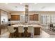 Gourmet kitchen boasts a large island and stainless steel appliances at 578 E Laddoos Ave, San Tan Valley, AZ 85140