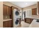 Laundry room with stacked washer and dryer, and ample counter space at 578 E Laddoos Ave, San Tan Valley, AZ 85140