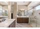 Elegant bathroom with a walk-in shower and double vanity at 578 E Laddoos Ave, San Tan Valley, AZ 85140