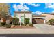 Single-story home with brown garage door and cacti at 578 E Laddoos Ave, San Tan Valley, AZ 85140