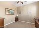 Spacious spare bedroom with wood nightstand and large artwork at 578 E Laddoos Ave, San Tan Valley, AZ 85140