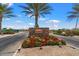 Encanterra community entrance with stone sign and flowers at 578 E Laddoos Ave, San Tan Valley, AZ 85140