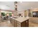 Center island kitchen with granite countertops and breakfast bar at 578 E Laddoos Ave, San Tan Valley, AZ 85140