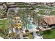 Community pool and pickleball courts with lush landscaping and palm trees at 578 E Laddoos Ave, San Tan Valley, AZ 85140